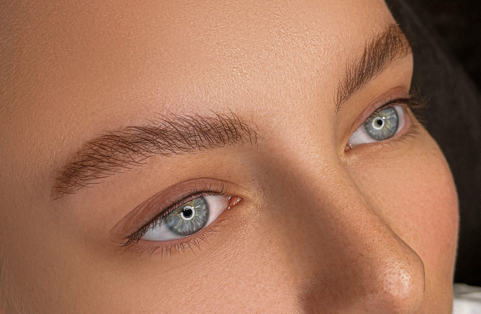 Close-up portrait showing permanent eyeliner