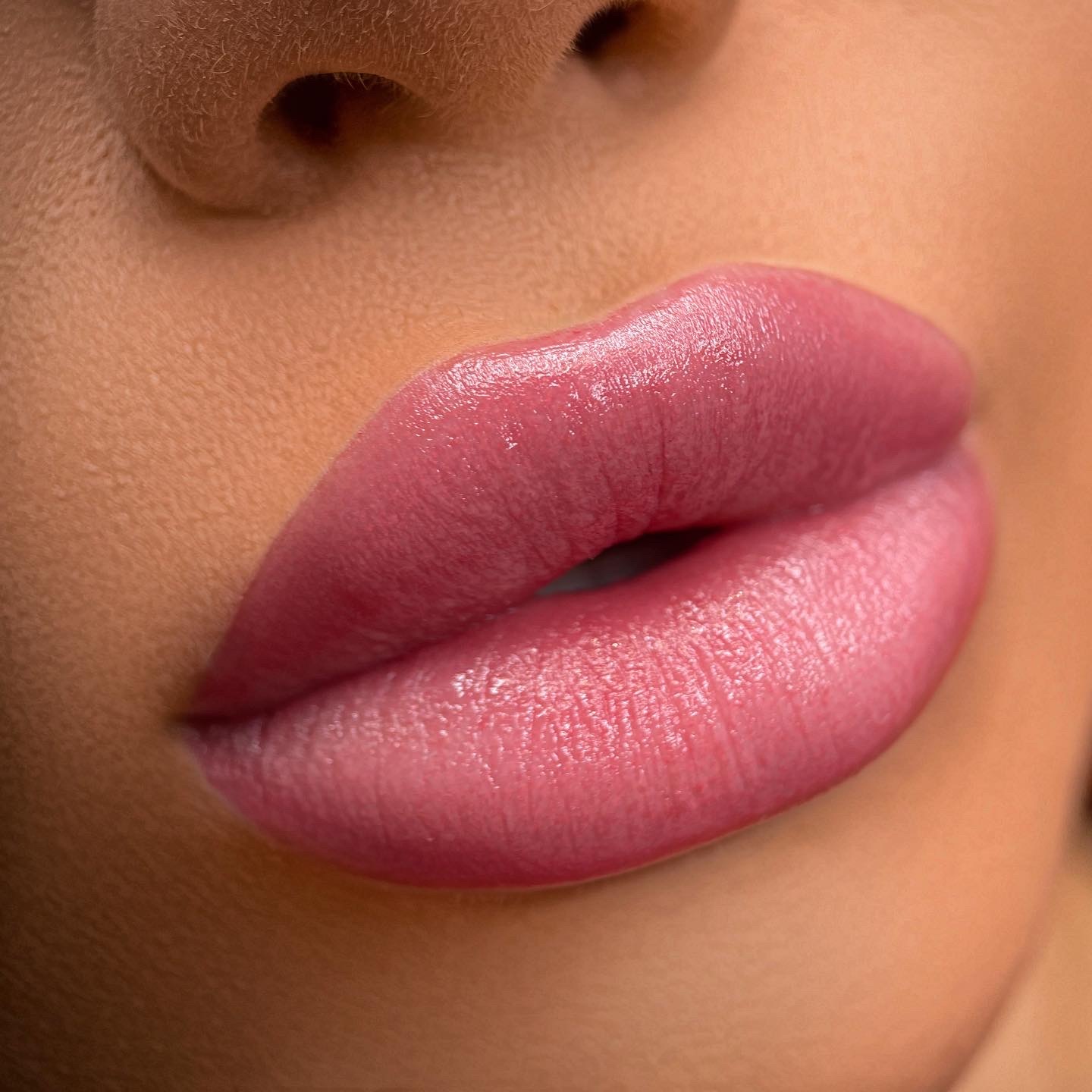 Close-up portrait showing lip blushing permanent makeup